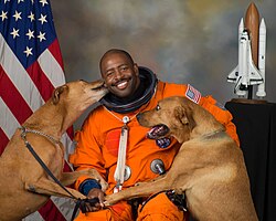 NASA astronaut Leland D. Melvin with his dogs Jake and Scout.jpg/2